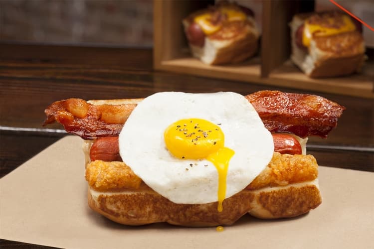 Grand Slam; smoked bacon, fried egg, tater tots, maple syrup sriracha