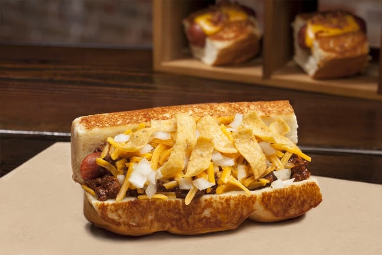 Little Leaguer; haus chili, fritos, diced onions, shredded cheese